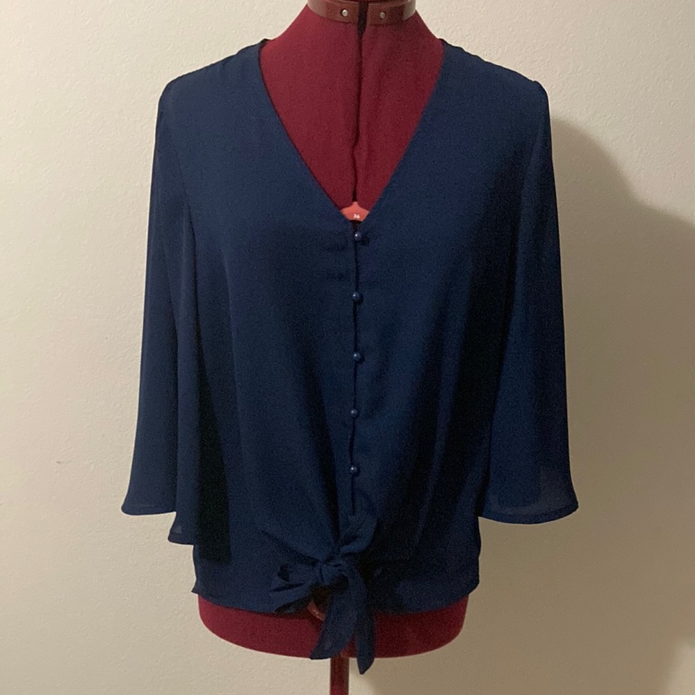 Kancy store size medium blue V neck buttoned down blue blouse with flare sleeves